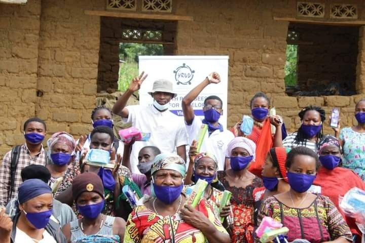 Women receiving sanitary supplies at a YRUD menstrual-health outreach session