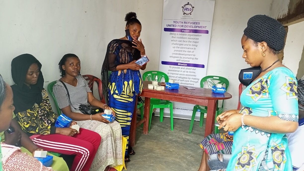 A YRUD training session with community members seated indoors